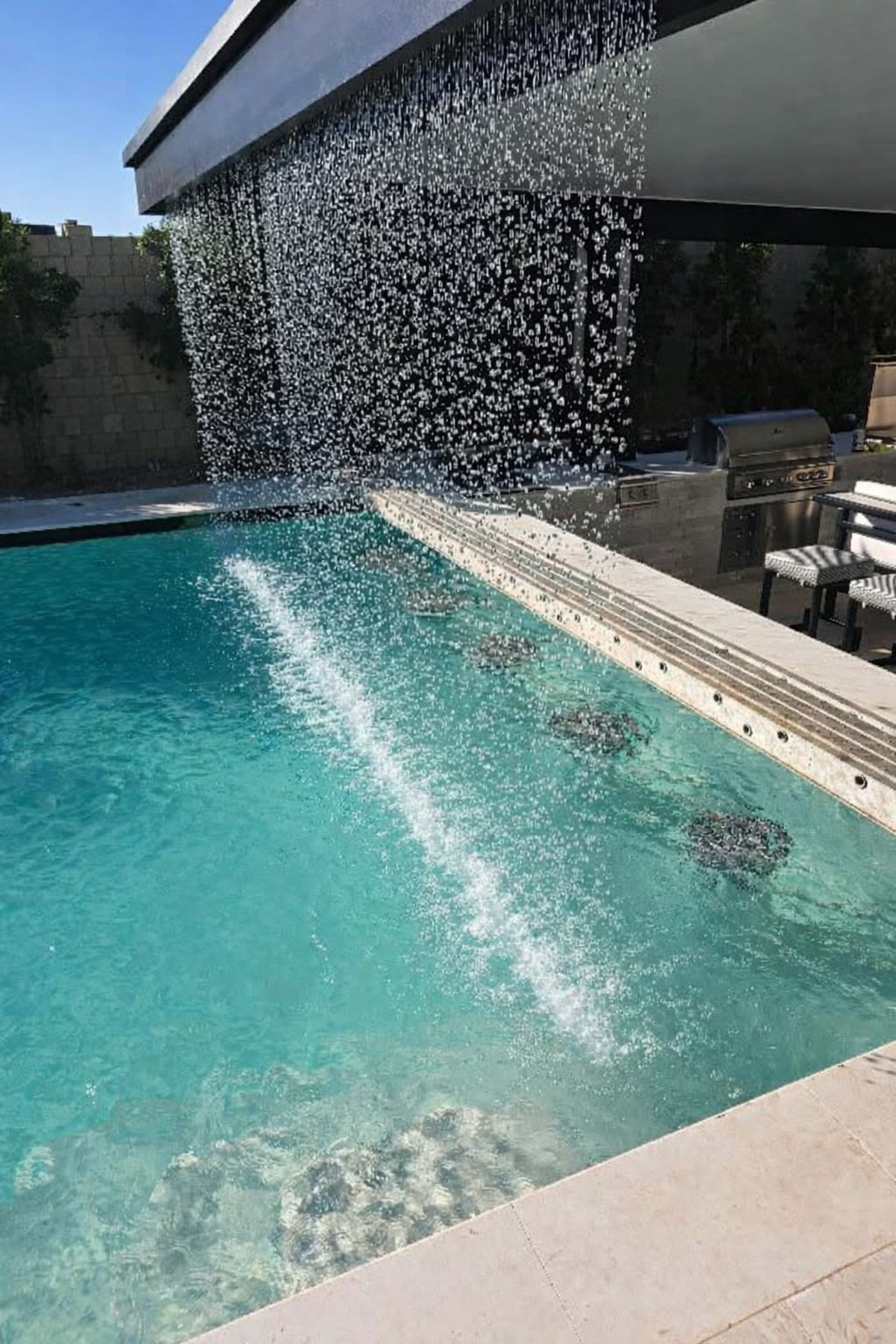 Aluminum pergola with TV wall and architectural features in Cherry Hills Village
